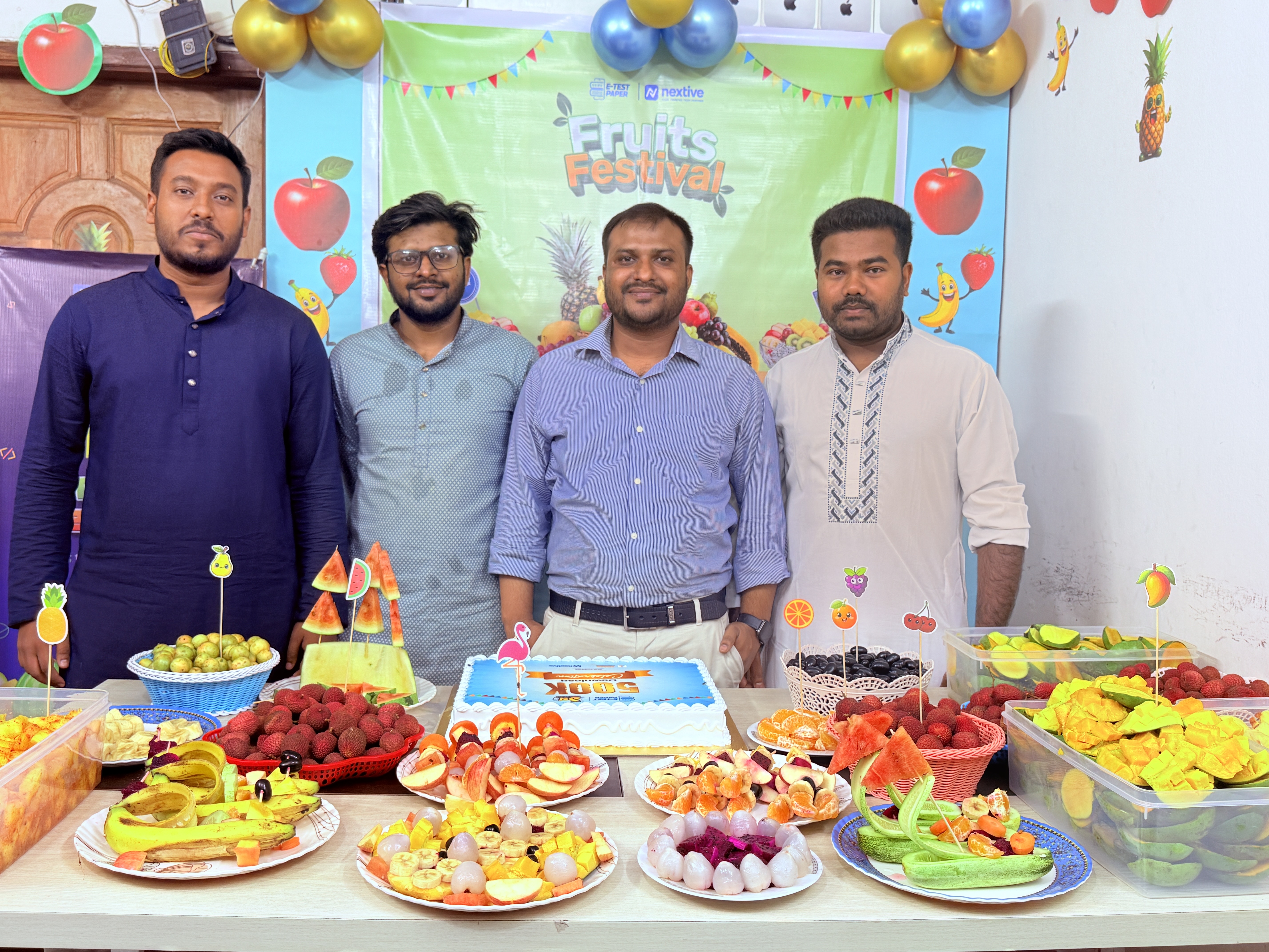 Team celebrating with decorations and balloons