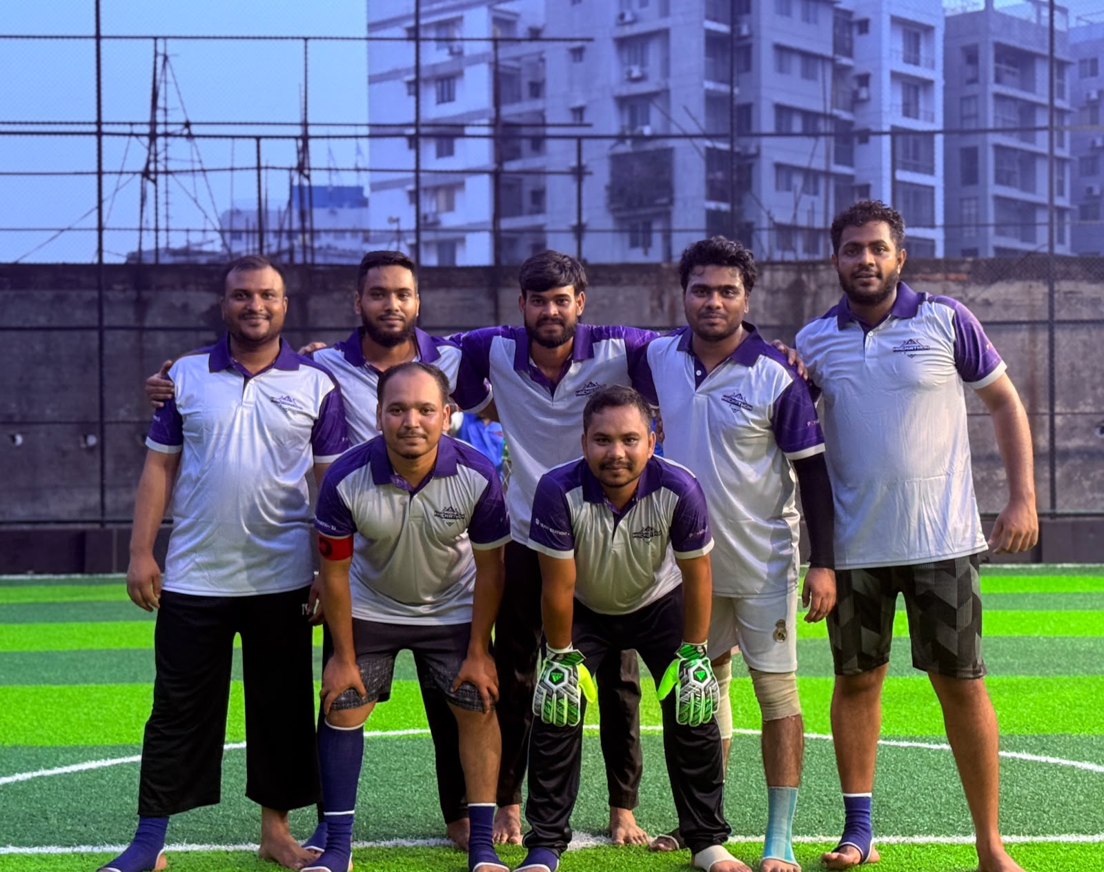 Team in matching jerseys ready for football